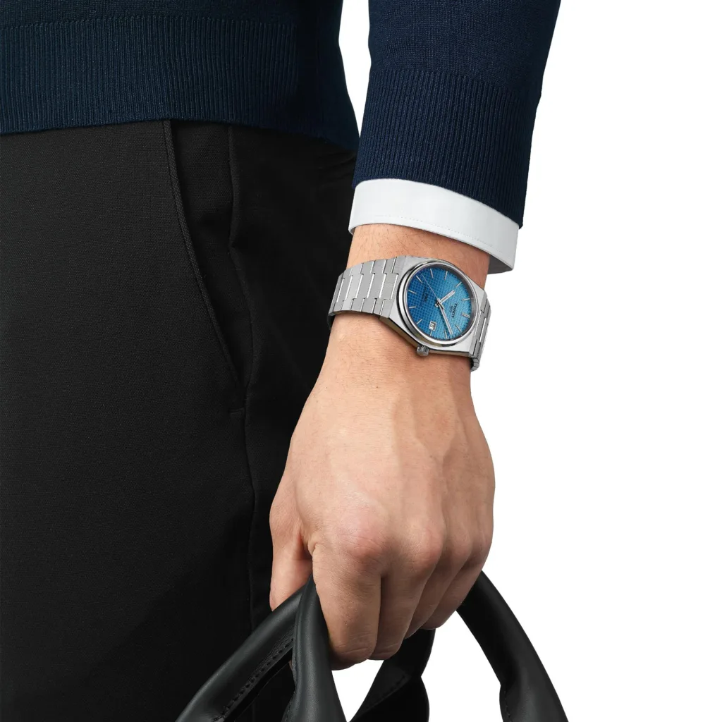 Tissot PRX watch with gradient dial worn on the wrist of model