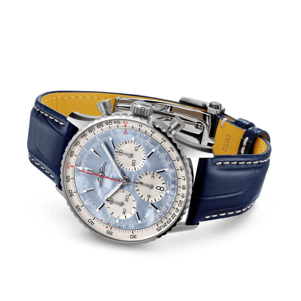 Breitling Navitimer B01 Chronograph 41 Japan exclusive with ice blue mother-of-pearl dial laying on table with alligator strap