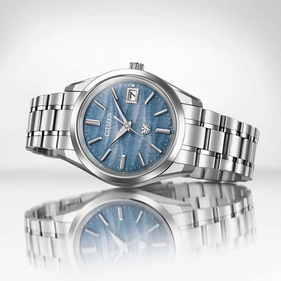 citizen iconic nature AQ4100-65H watch on reflective surface