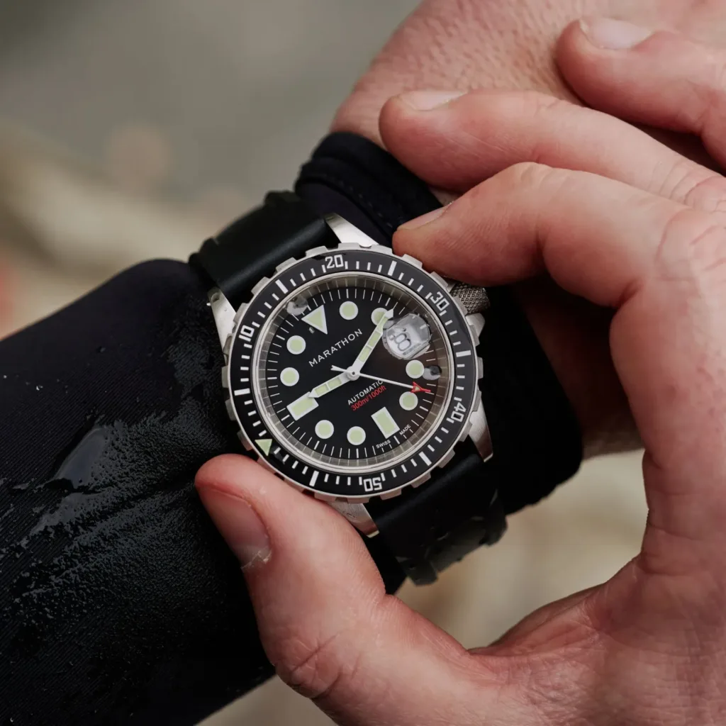 marathon osar-d watch with rubber strap, worn on wrist of diver